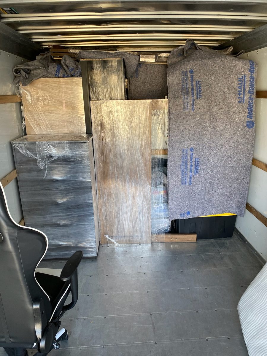 Furniture padded and wrapped with moving blankets inside a truck by our Omaha moving labor crew